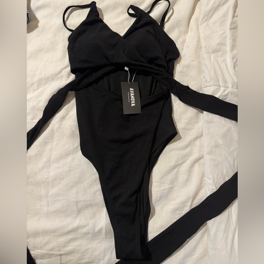 Women’s medium black high cut one piece medium swimsuit.